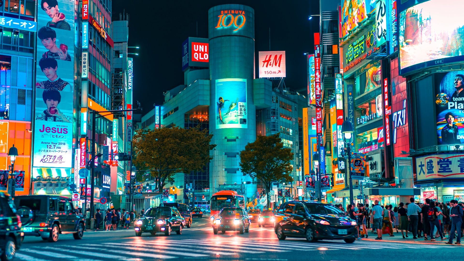 people gathered outside buildings and vehicles