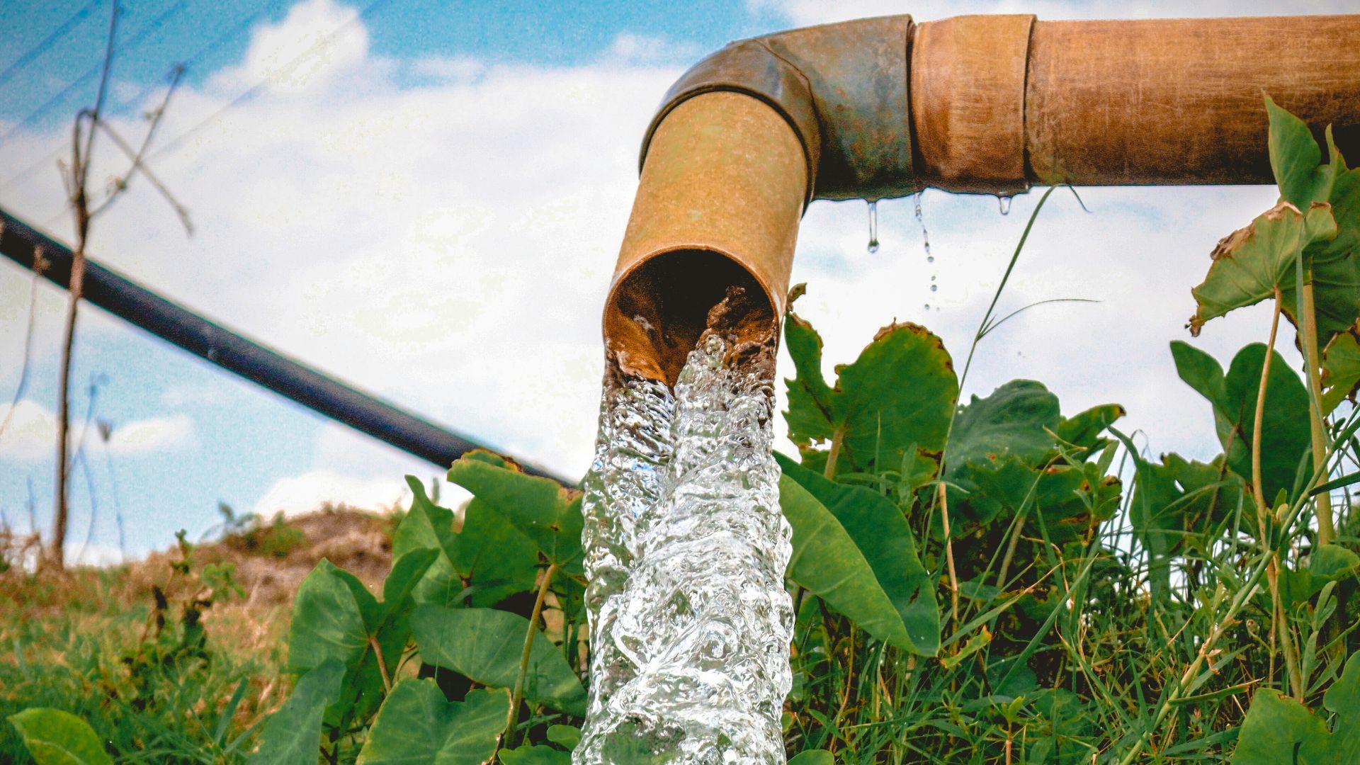 a pipe that has water coming out of it
