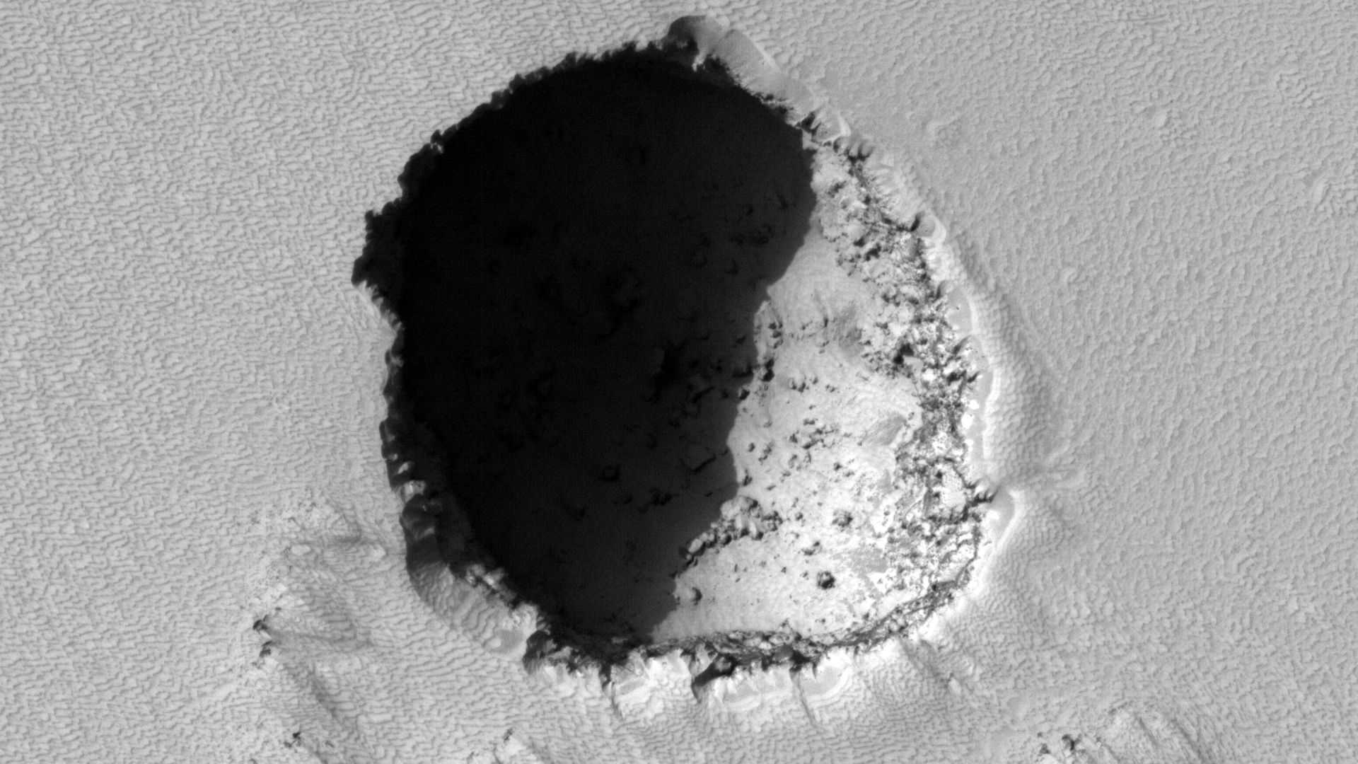 File:Pavonis Mons eastern flank lava tube skylight crop sharp.jpg