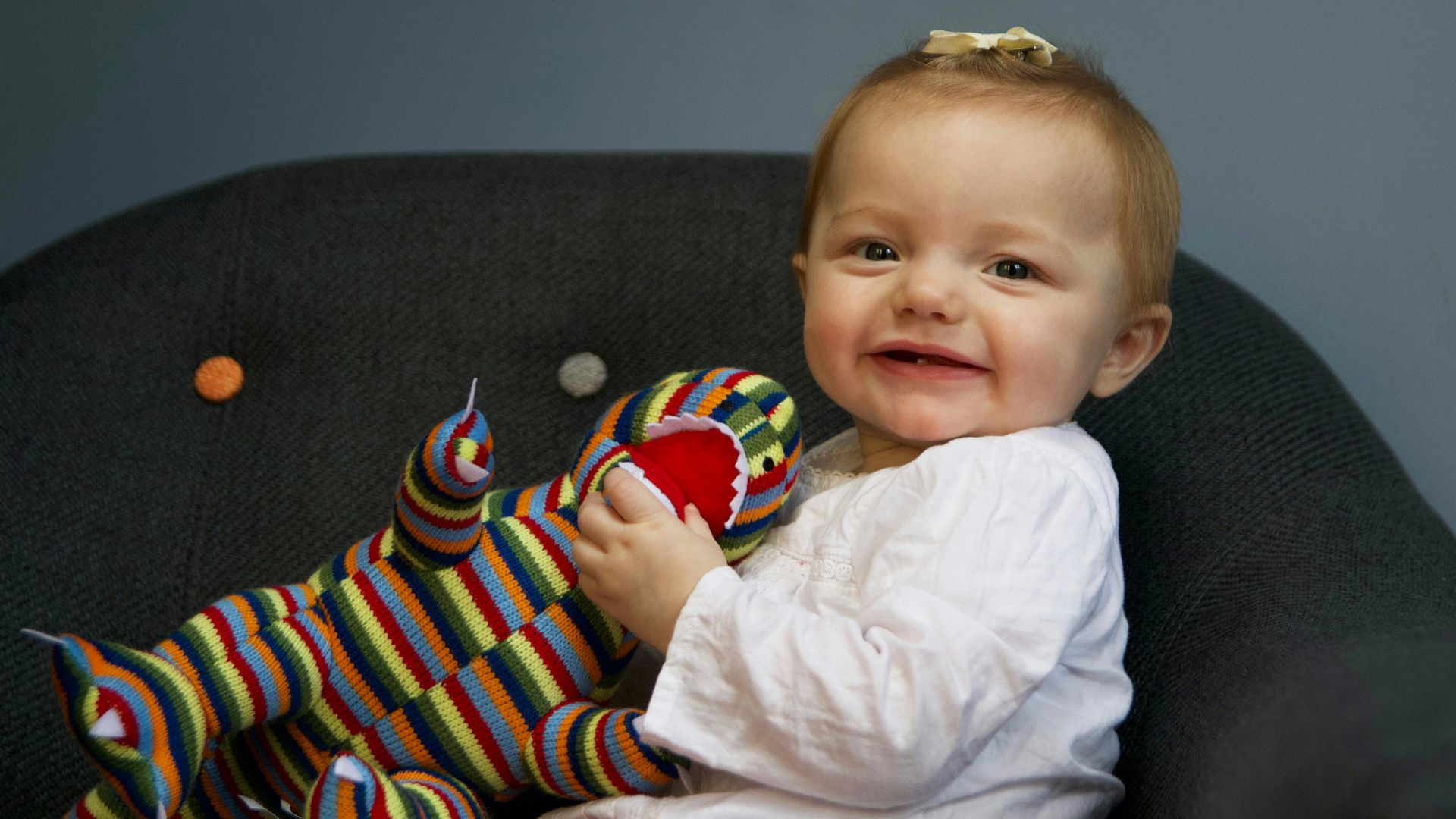 baby siting on chair
