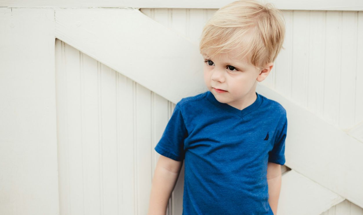 Boy in blue crew neck t-shir