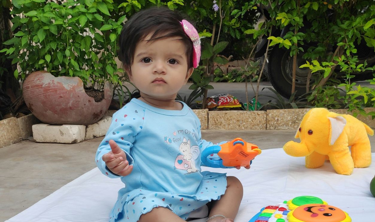 Baby girl dressed in blue