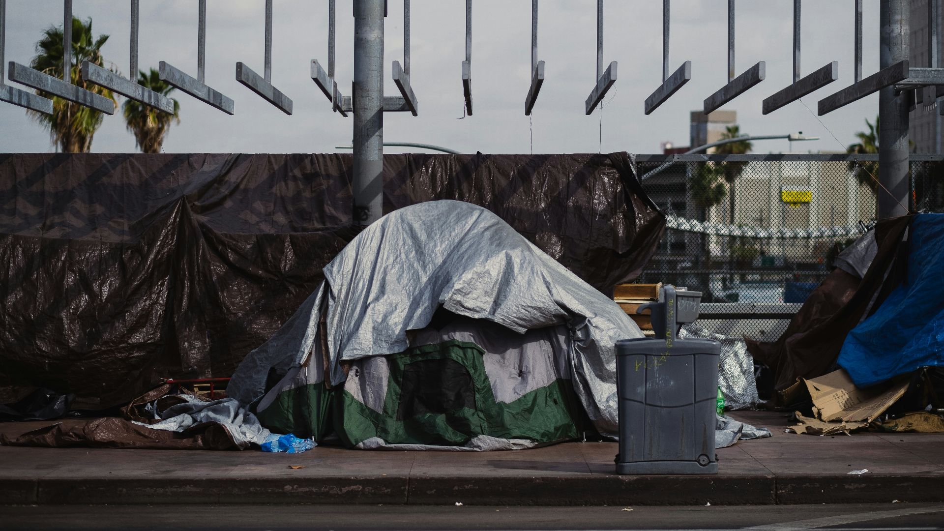 a pile of garbage sitting on the side of a road