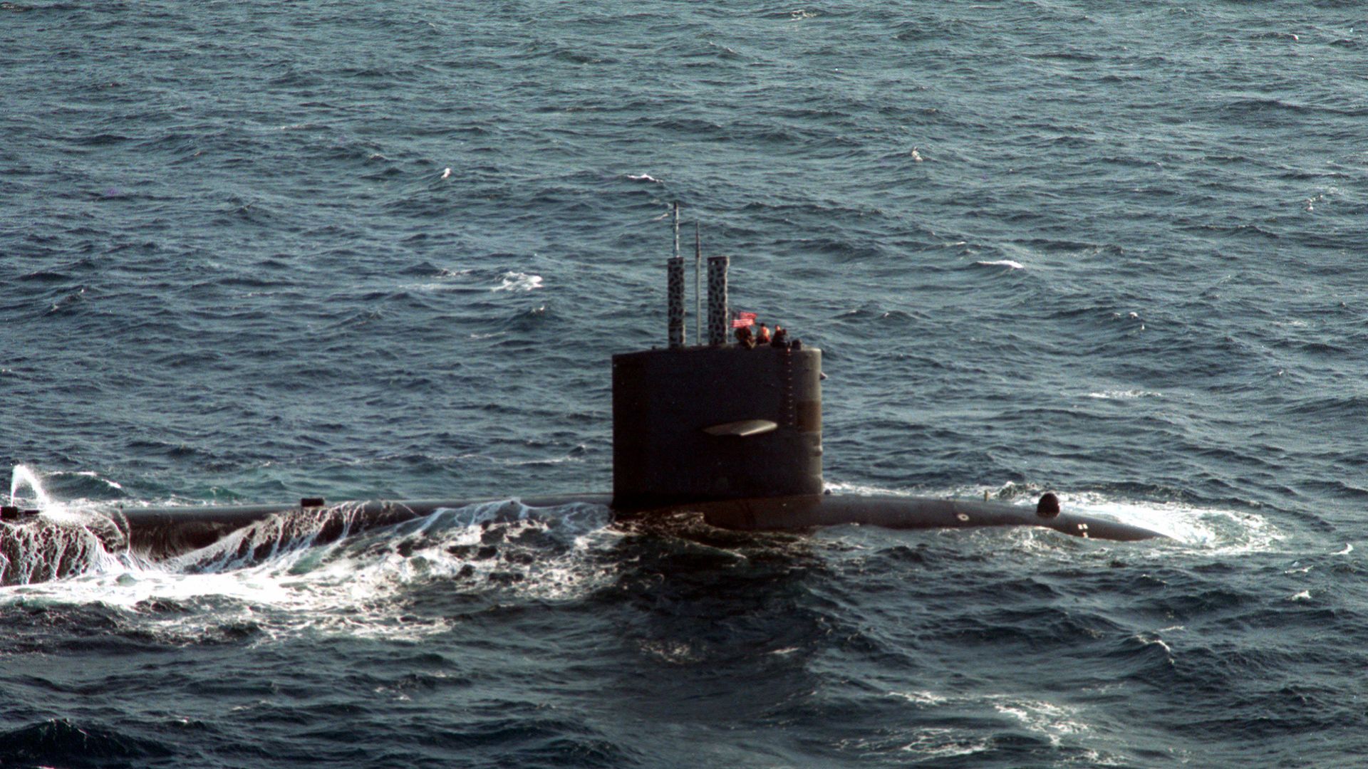 File:A starboard view of the sail section of a Sturgeon class submarine underway on the surface during anti-submarine warfare exercises with the aircraft carrier USS RANGER (CV-61) - DPLA - a7f05293498ddbf0c8847d62ea50e0d8.jpeg