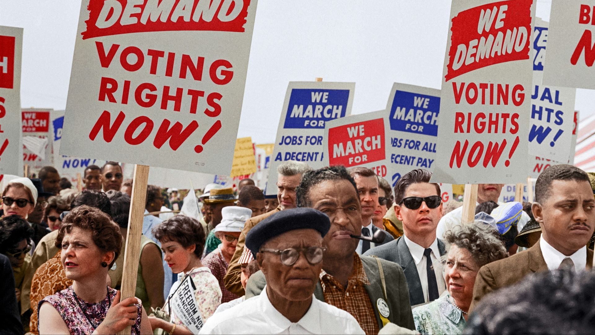 Marchers holding signs demanding the right to vote at the March on Washington