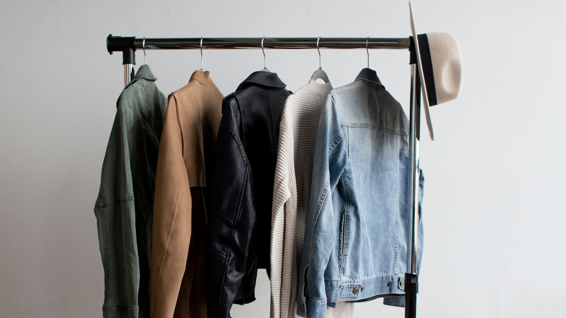 five jackets on clothes rack