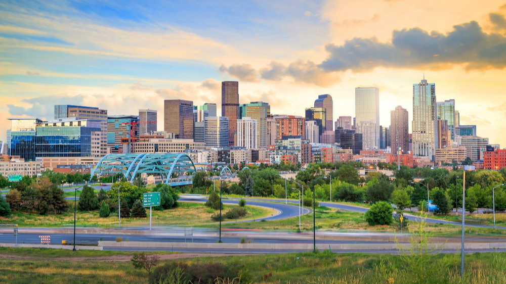 The image showcases a Vibrant urban scene of Denver, Colorado captured from a high vantage point