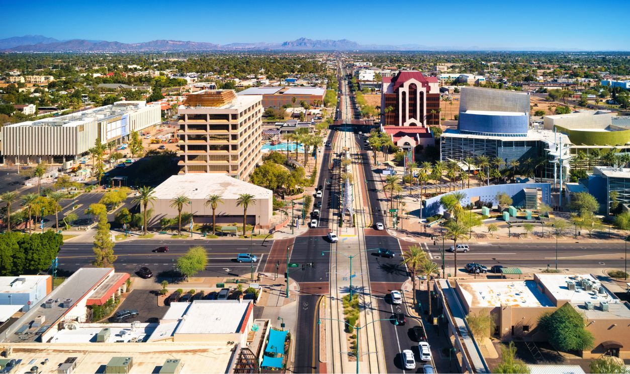 Aerial of Downtown Mesa, Arizona, with a light rail line in the center. Mesa is part of the Phoenix Metropolitan Area.