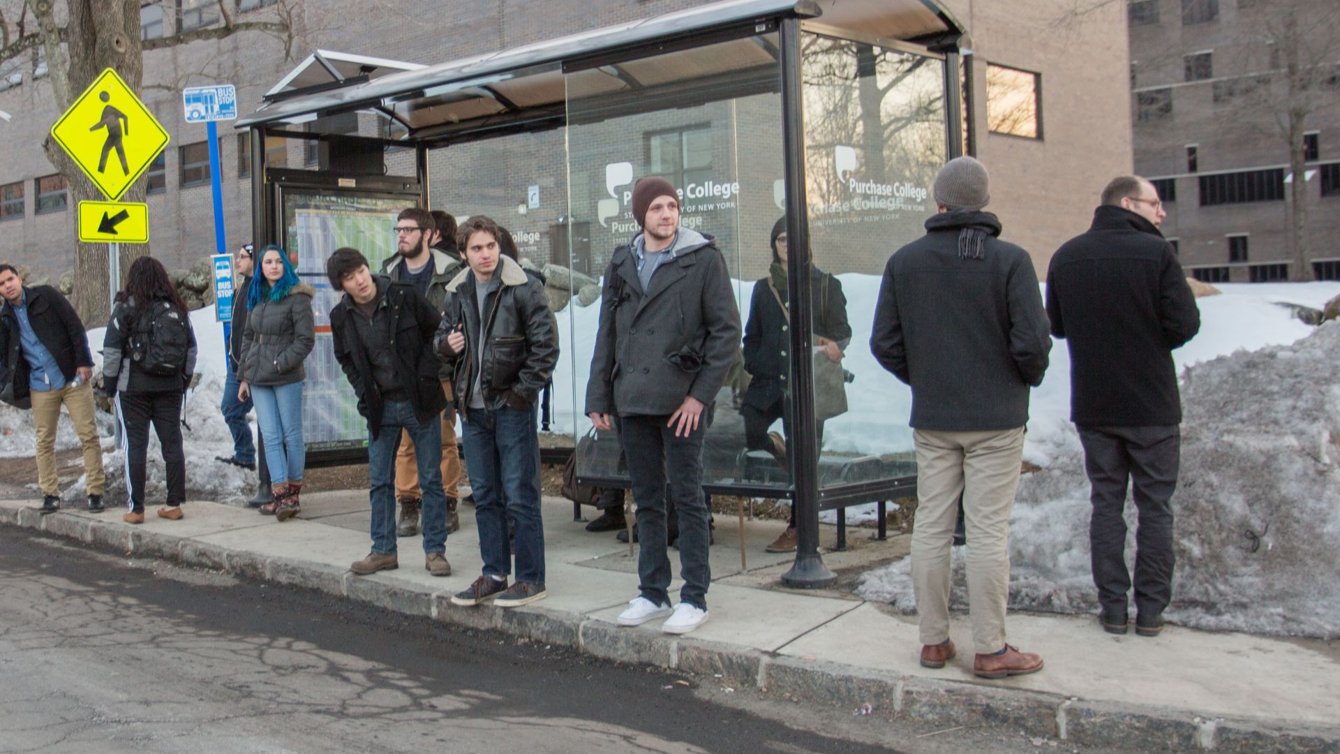 File:People waiting at bus stop.jpg