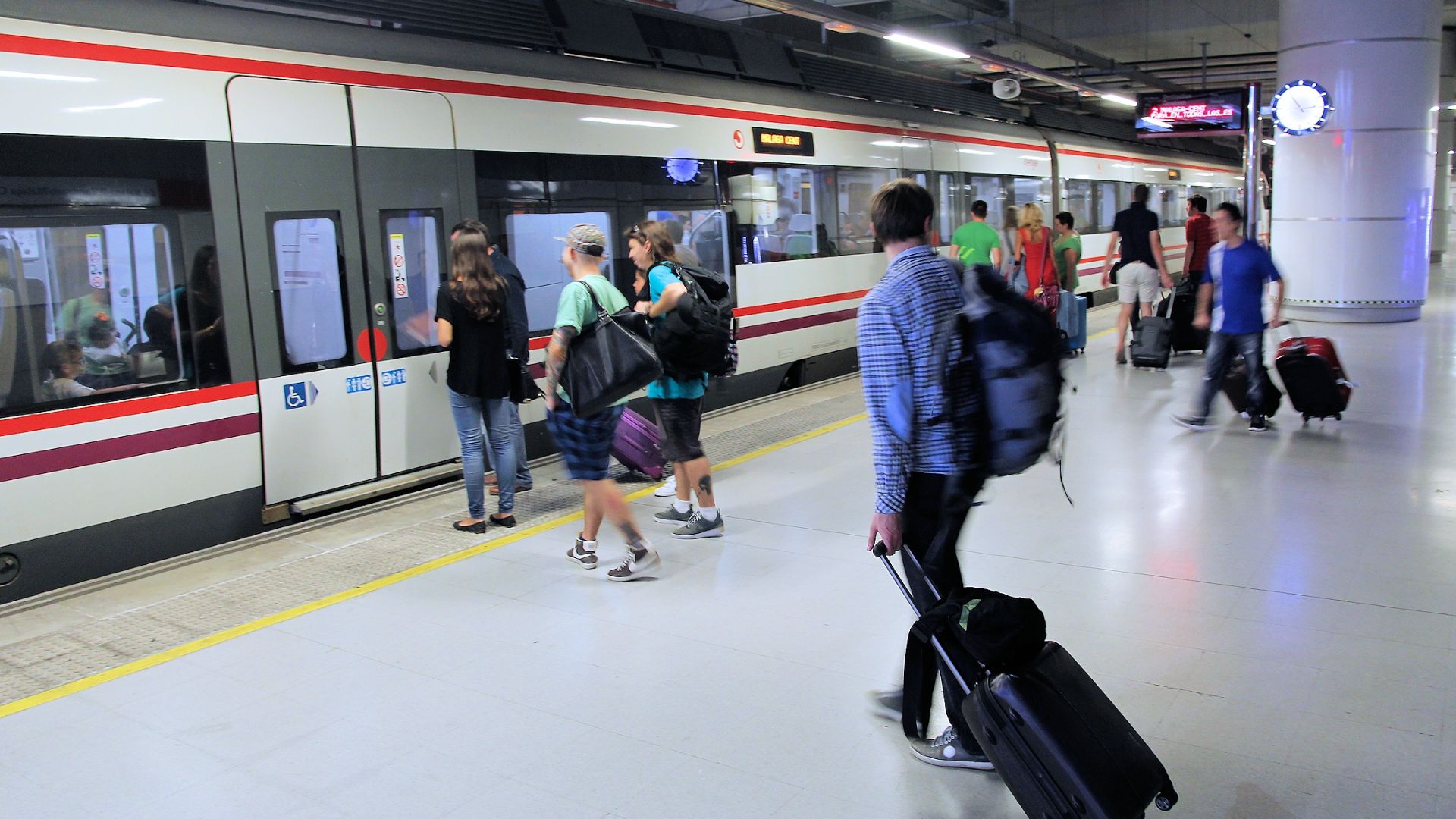 File:008 People with suitcases at Malaga Airport train station - Malaga Airport.jpg