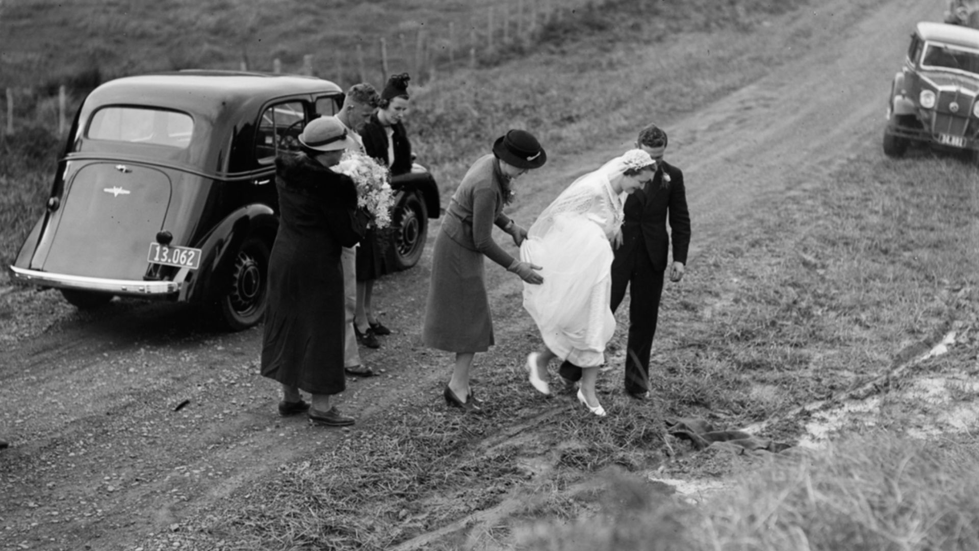 File:A bride walking across a gravel road (AM 75864-1).jpg