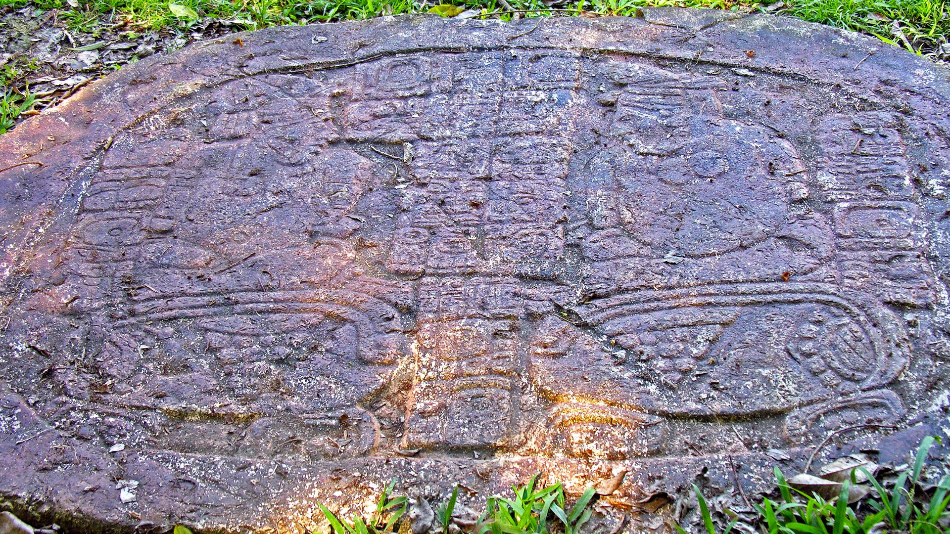 File:Carved altar at Maya site of Caracol, Belize, showing captives from Bital and Ucanal.jpg