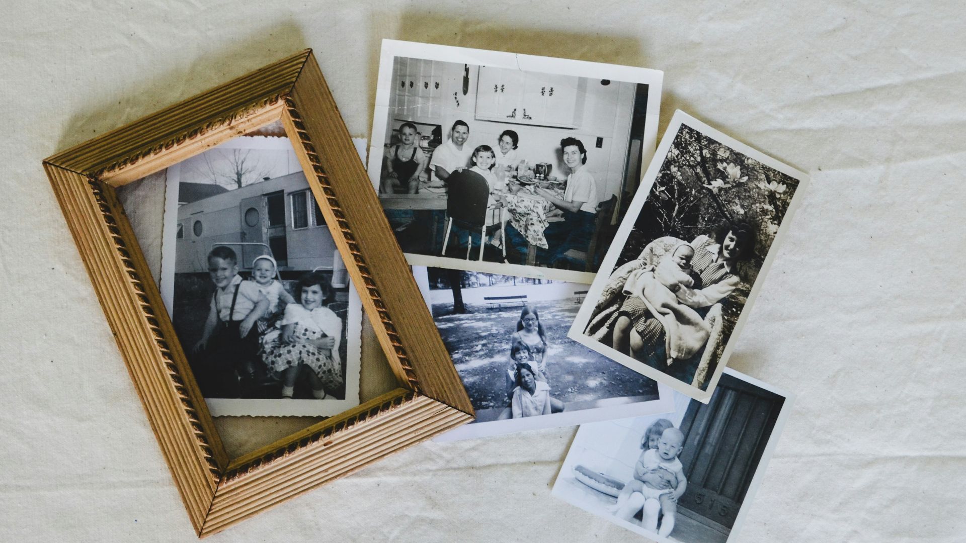 A group of photos sitting on top of a white sheet