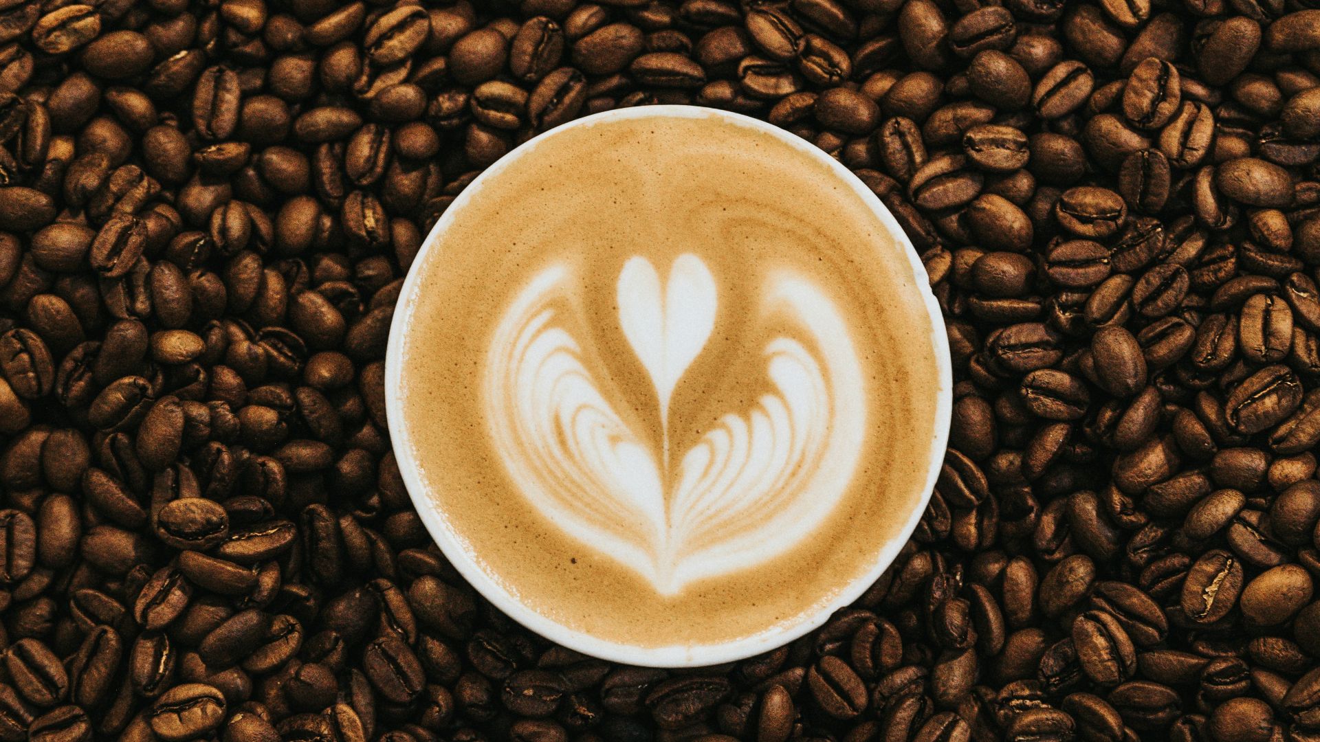 top view photography of heart latte coffee
