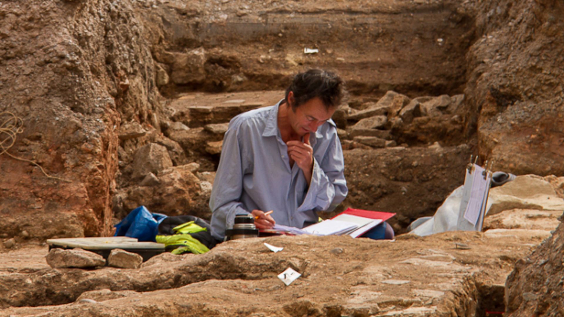 File:Archaeologist working in Trench.jpg
