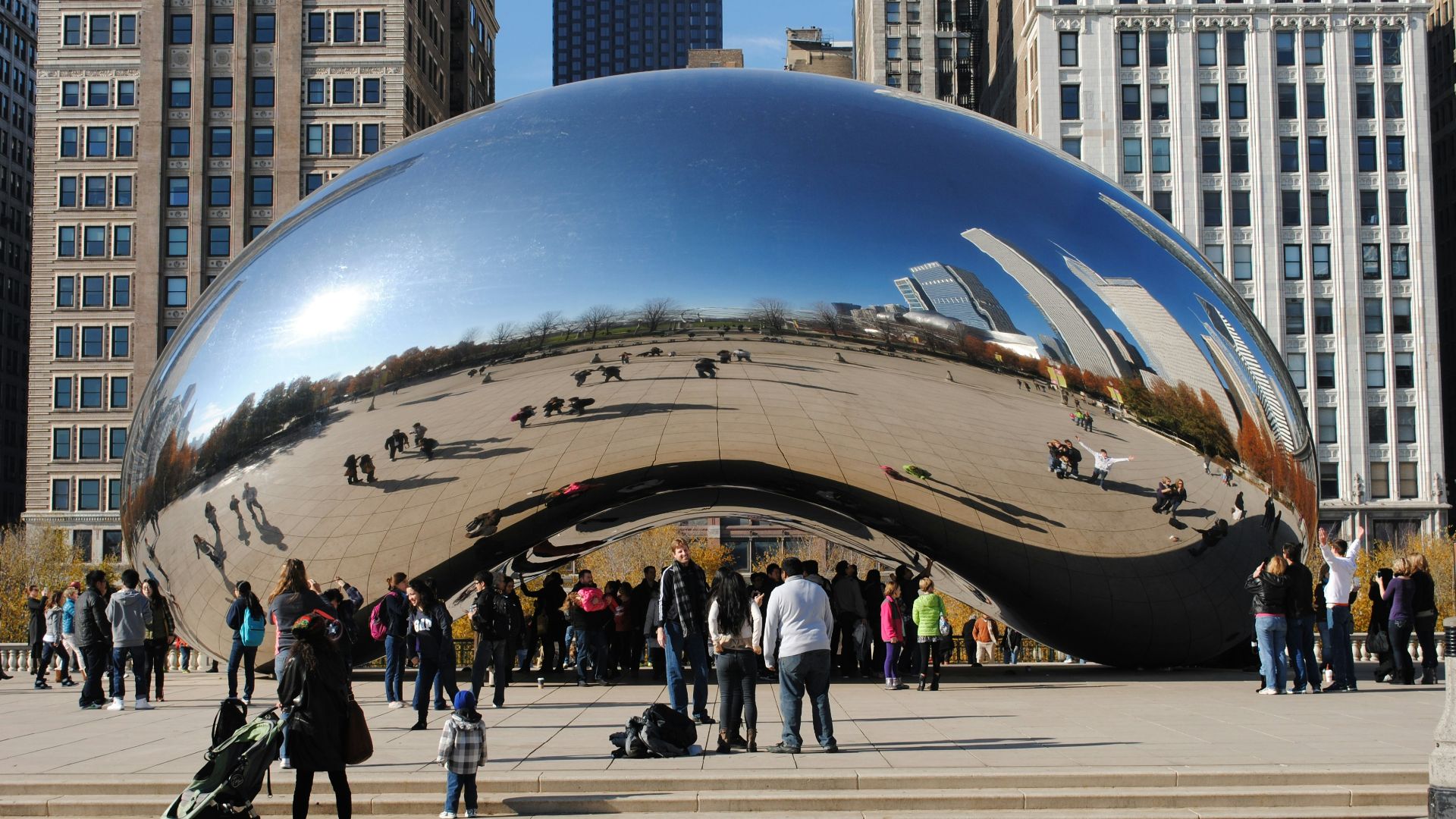 people walking on street near cloud gate during daytime