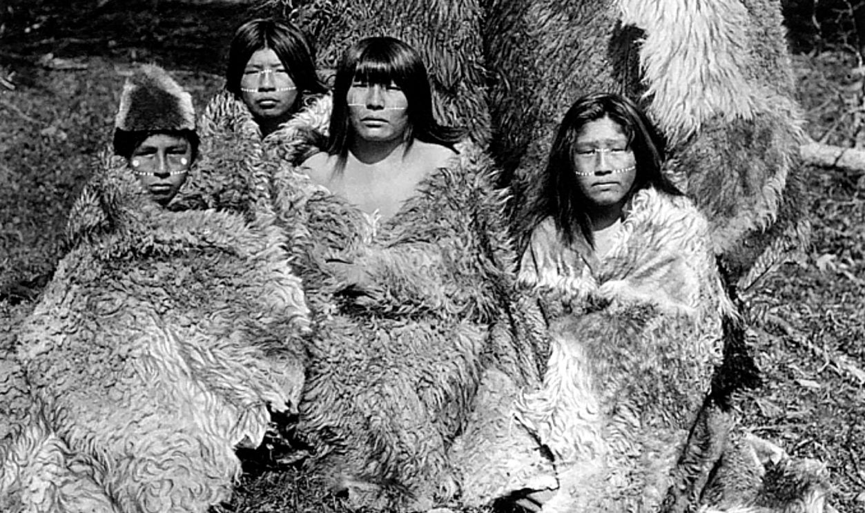 Indigenous people of the Great Tierra del Fuego Island, the Selk'nam (Ona): group of women (dressed in guanaco fur coats).