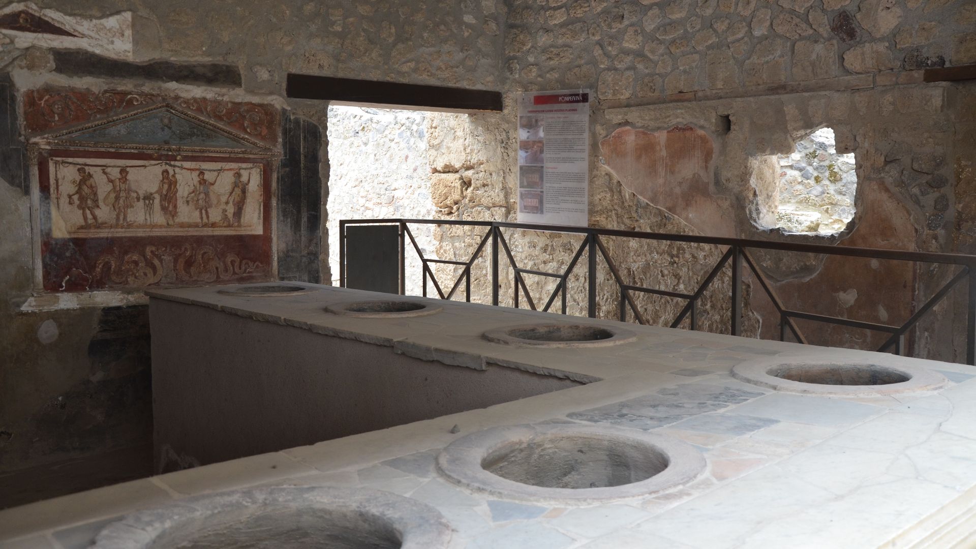File:Thermopolium of Vetutius Placidus opening directly onto the south side of the Via dell'Abbondanza, Pompeii (15042641332).jpg