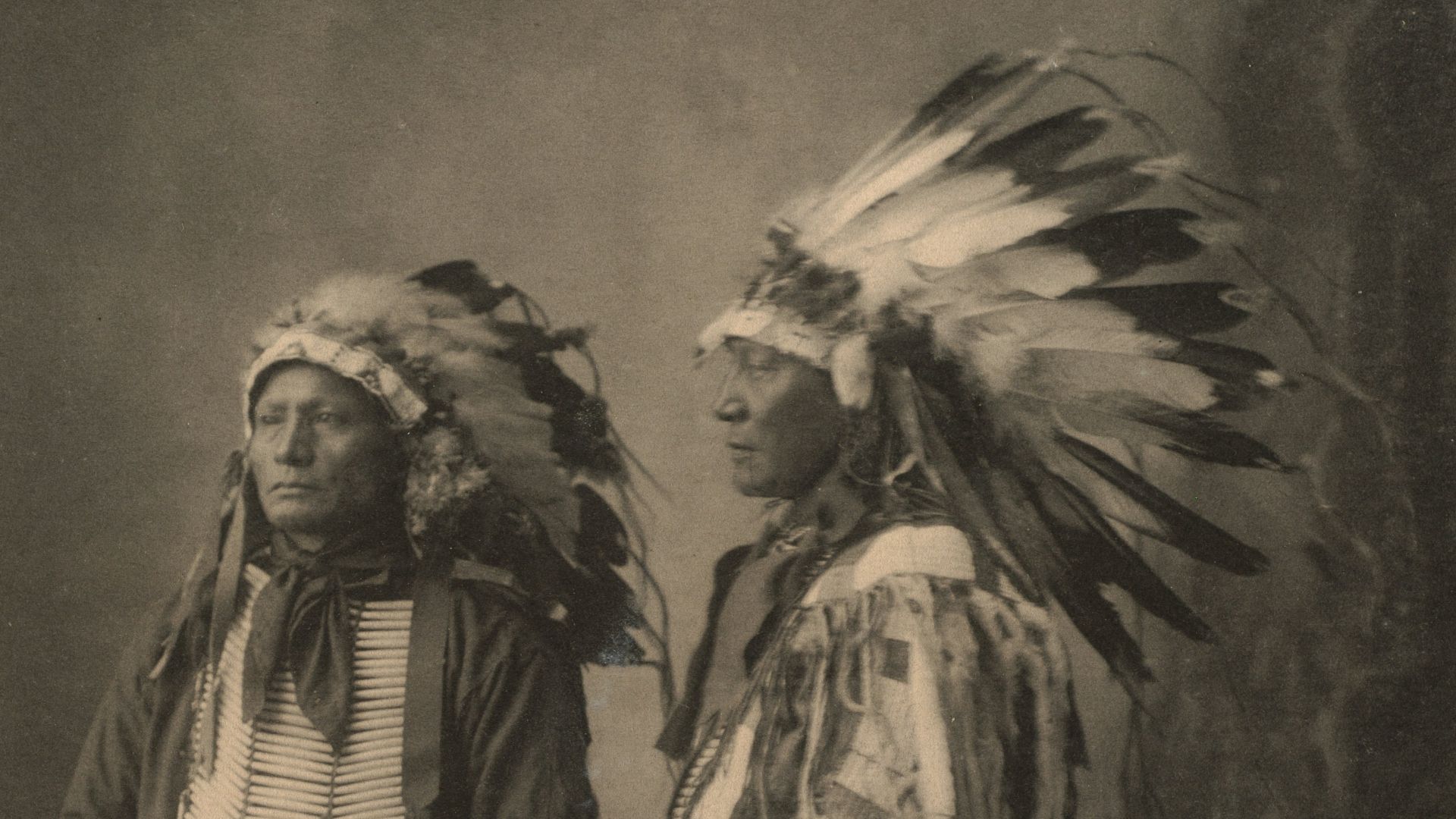 woman in black and white dress holding stick painting