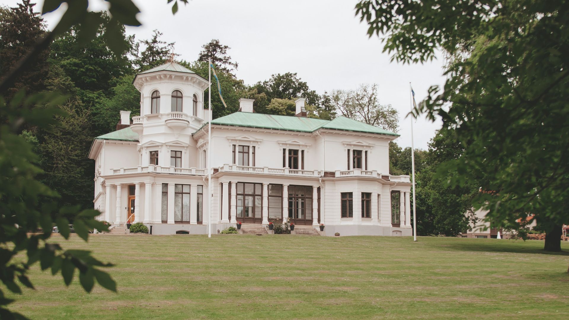 white concrete building near green grass field during daytime