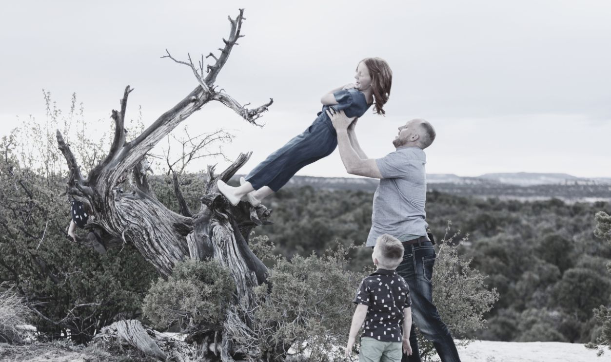 Mother's Day - Young Family Father and Sons Daughters Outdoors Evening In Colorado West - stock photo Mother's Day - Father, Sons and Daughters Family in Rural Western Colorado Outdoors on a Spring Evening - backlit with late afternoon sun and focal variations - included sign created by photographer