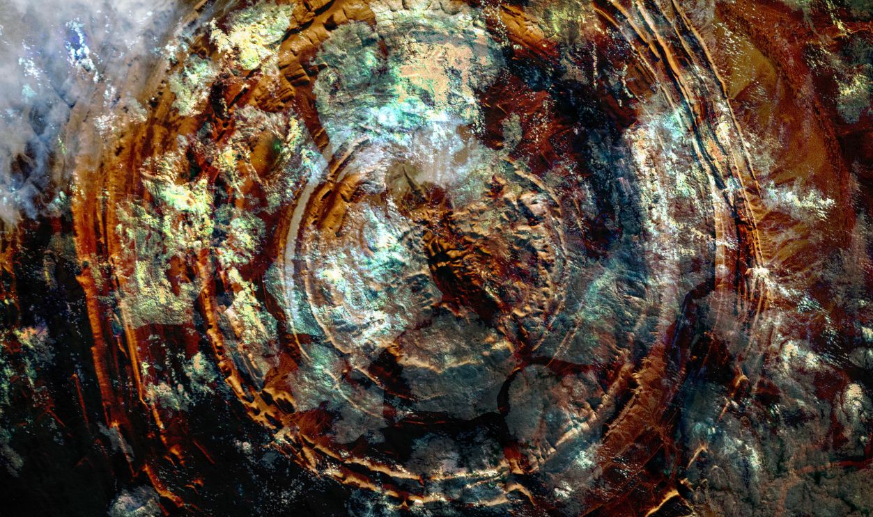 The Richat Structure of Mauritania circular feature under clouds, collage. Elements of this image furnished by NASA. - stock photo