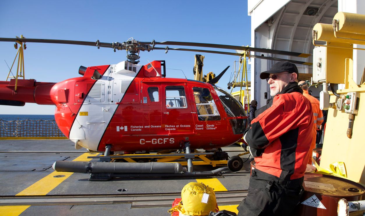 GJOA HAVEN, NU - SEPTEMBER 2: ABOARD CCGS SIR WILFRID LAURIER--Archeologist Douglas Stenton, Nunavut's director of heritage, waits to board Coast Guard icebreaker CCGS Sir Wilfrid Laurier's helicopter last week, when the Franklin Expedition shipwreck was discovered. 