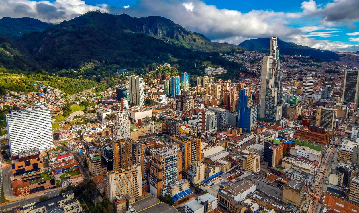 Bogota cityscape of big buildings and mountains and blue sky