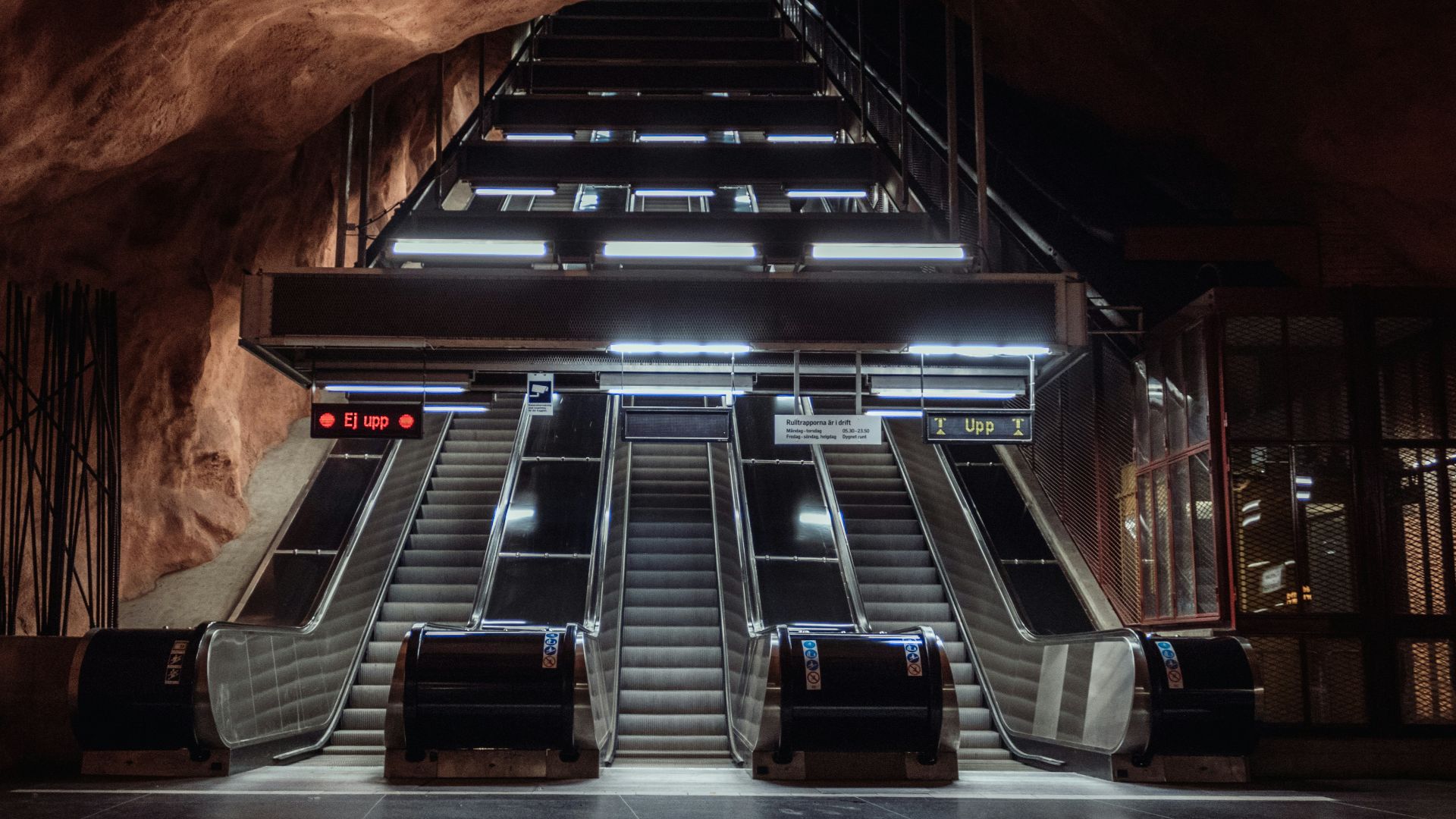 empty three escalator inside cave