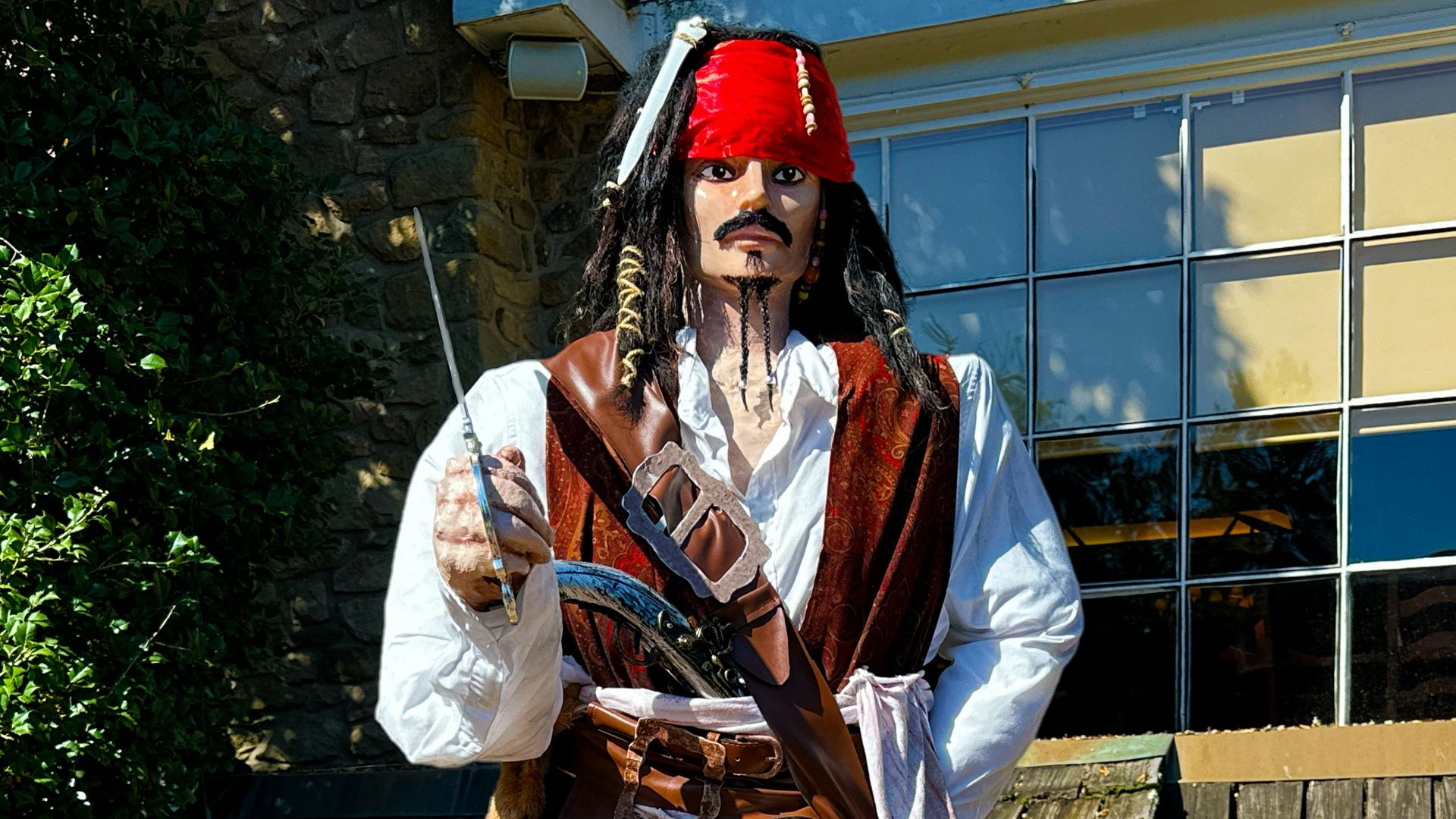 a man dressed as a pirate holding a gun
