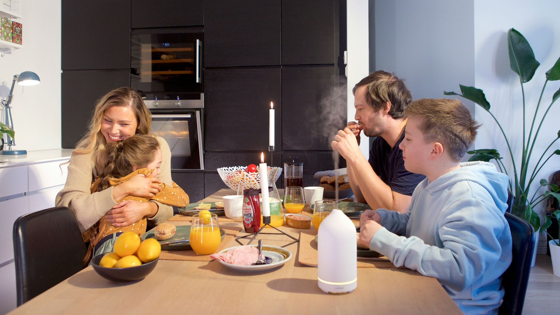 a group of people sitting around a table eating food