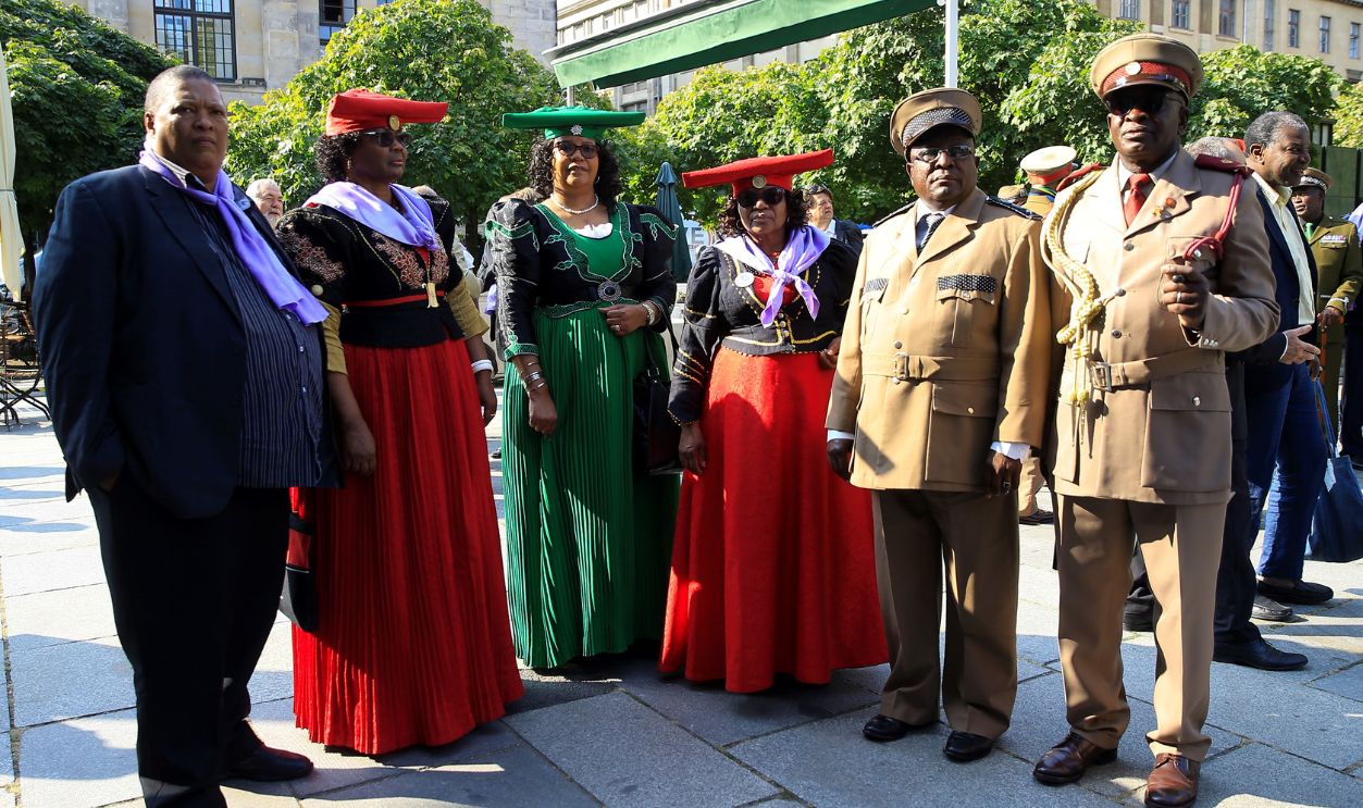 Namibian tribal chiefs and guests attend a ceremony at Frenzosische Dom in Berlin held for the victims of Namibian genocide, on August 29, 2018 in Berlin, Germany. Germany on Wednesday handed over the remains of some 20 Herero and Nama people murdered in the early 20th century by German colonial troops in Namibia. 