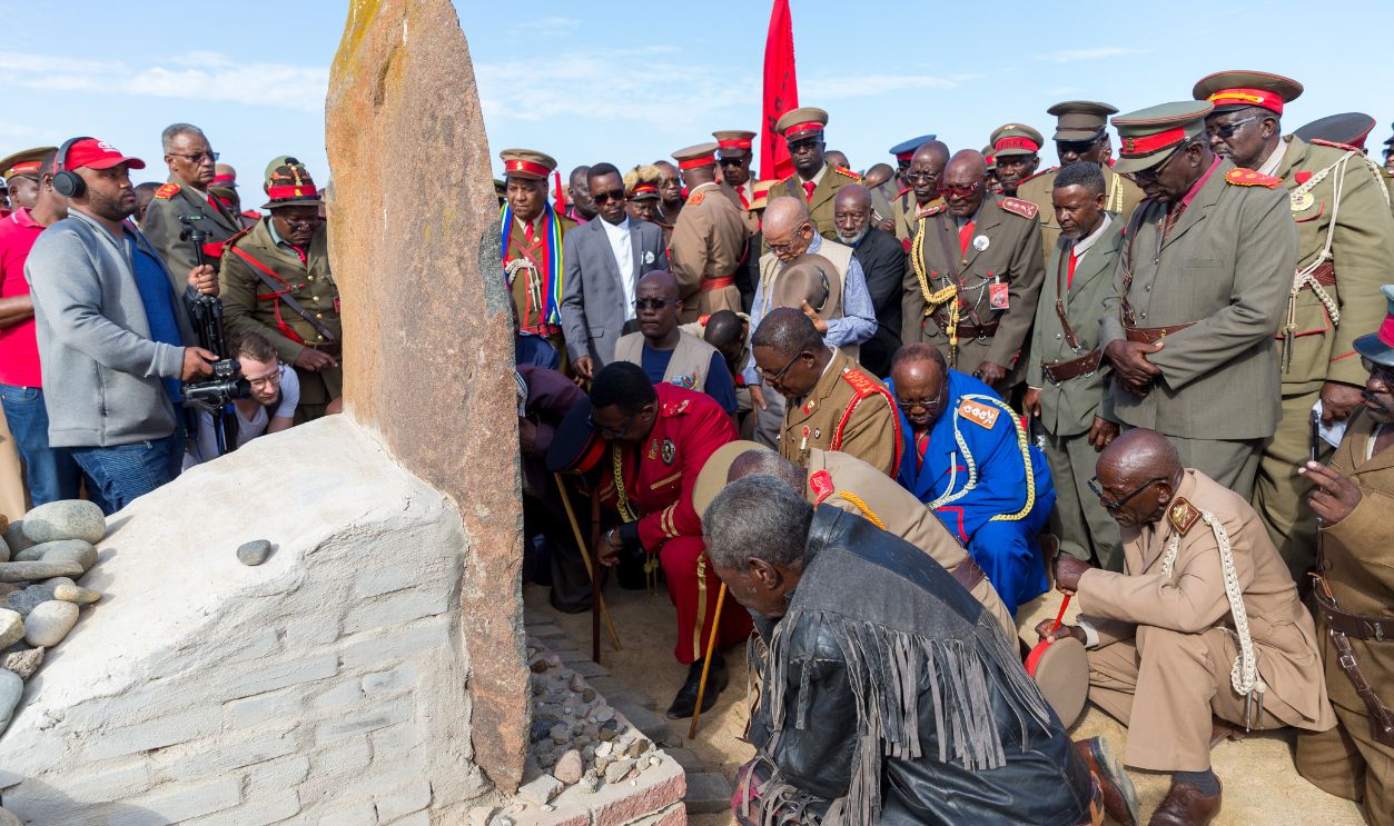 Paramount Chief Adv. Vekuii Rukoro (M, red uniform), other high-ranked chiefs and other members of the Herero and Nama communities take part on the Reparation Walk 2019, organized by the Ovaherero Genocide Foundation (OGF) and respectfully gather around a monument in honor of the Ovaherero and Nama people that were victims of the genocide by German colonial forces on the begining of the 20th century, at the Swakopmund Concentration Camp Memorial, in Swakopmund, Namibia, on March 30, 2019. Located on the coast of Namibia, Swakopmund is one of the most populous cities in the country and one of the best preserved examples of German colonial architecture in the world. Since 2007, every year, at the end of March, people of the Herero and Nama communities take part on the Reparation Walk to honor the victims of the German colonial power over the country and to demand reparation from the German state.