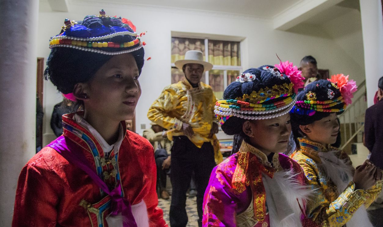  Mosuo girls attend a Coming-of-Age party celebrated during the first week of the Lunar New Year on February 8, 2019 in Ninglang County, China. In recent years, Yunnan Province in Southwest China has become one of the country’s top travel destinations for the Lunar New Year holiday. Yunnan’s popularity is closely tied to its cultural diversity; The province is home to 25 of China’s 56 government recognized minorities and a booming ethnic tourism industry for travelers looking to experience local cultures. Lugu Lake, a once remote scenic area, has seen a spike in tourism since the completion of a new highway in 2017, making it more accessible to visitors. Tourism has been vital to local economies around Lugu Lake but it also presents a challenge for cultural preservation for minorities including Mosuo, Yi, Naxi, Pumi and Tibetan. 