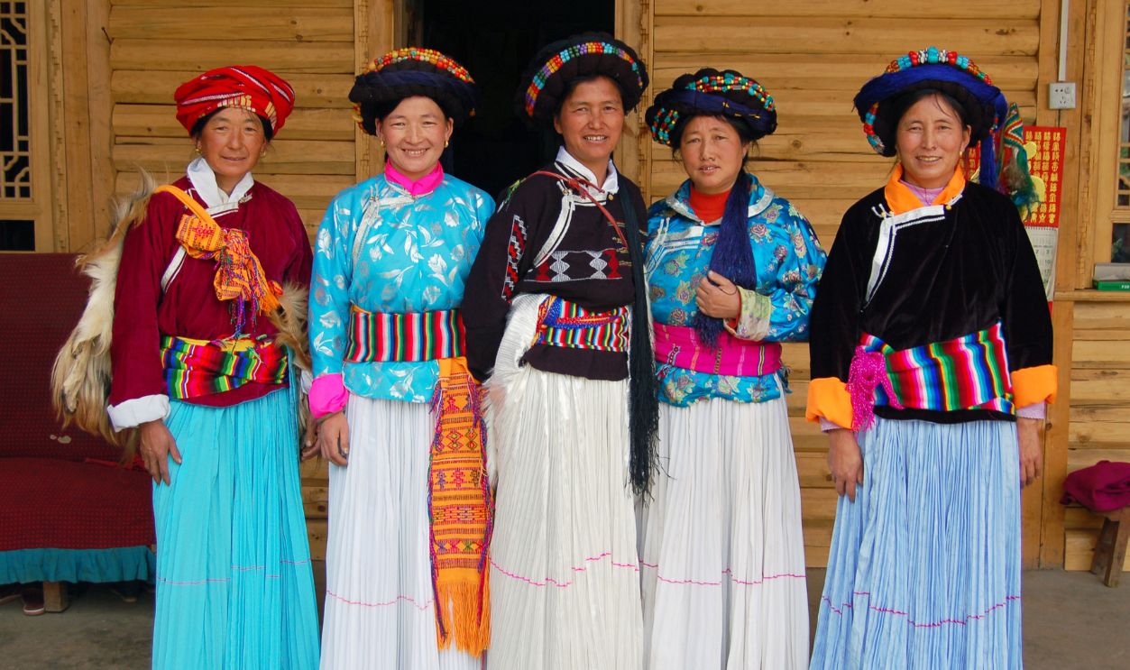 Women of Mosuo ethnic group pose for a photo at Lugu Lake area on May 01, 2010 in Ninglang Yi Autonomous County, Yunnan Province of China. Lugu Lake is called the 'mother lake' by the Mosuo people and it becomes 'the Kingdom of Women' and 'Home of the Matriarchal Tribe'