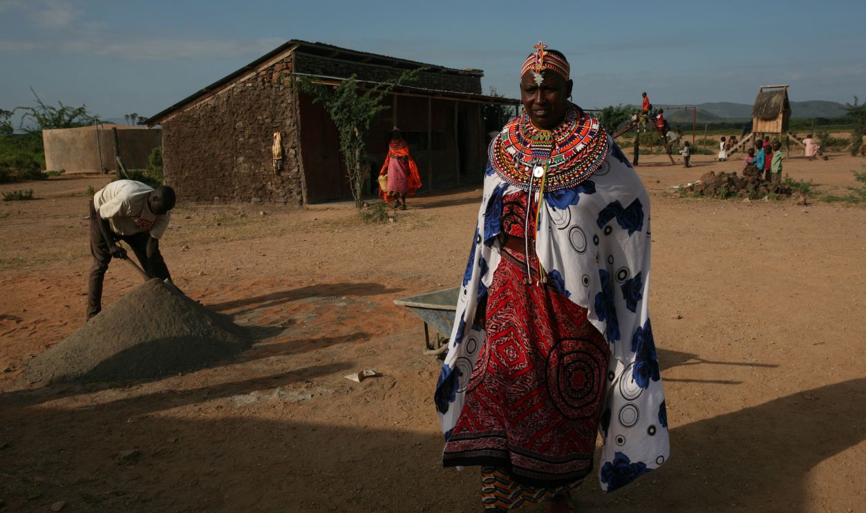 Rebecca Lolosoli, the matriarch of an all-female village in Kenya that offers a haven to those fleeing forced marriages or abuse, walks through the village. Ten years ago, she and a group of women established the village of Umoja, which means 