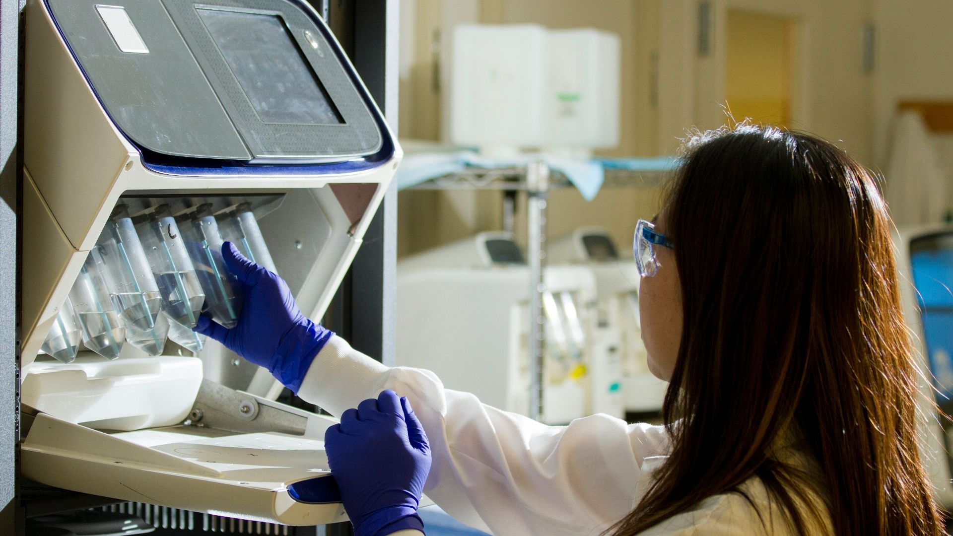 woman holding test tubes