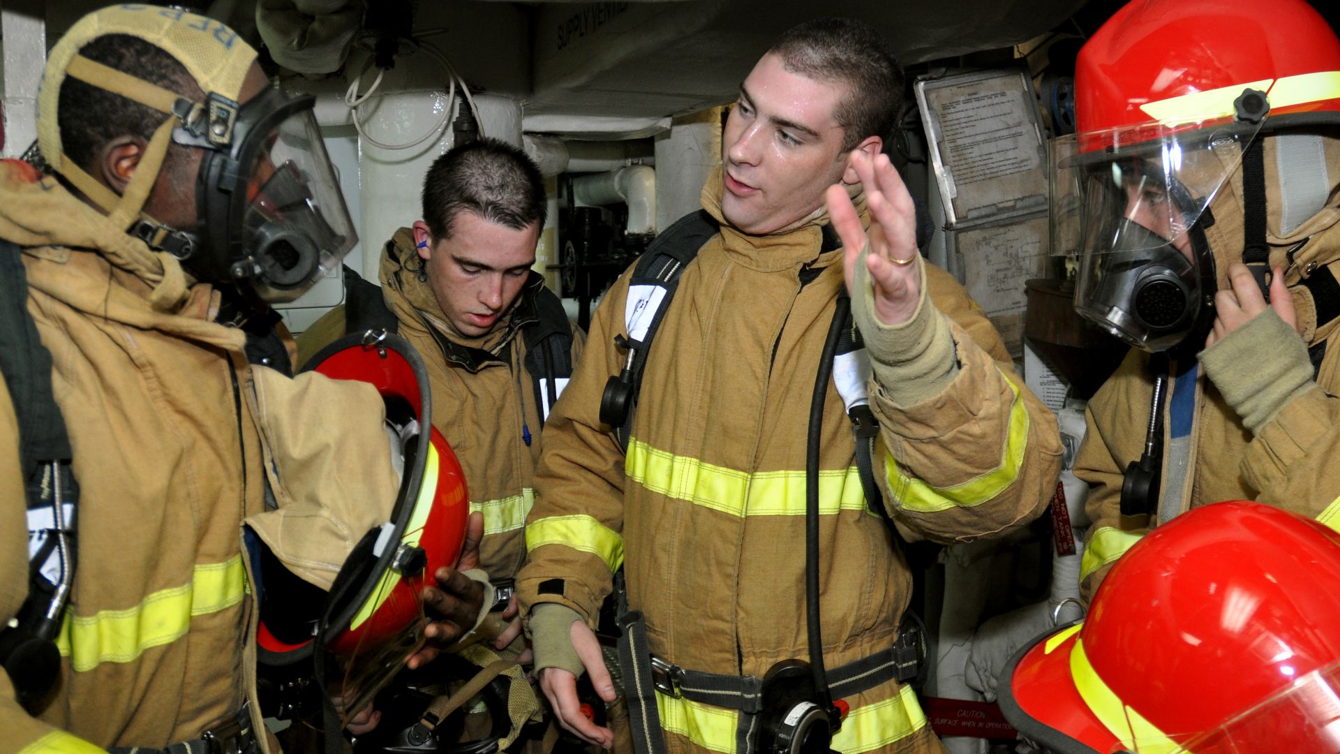 File:US Navy 101031-N-7293M-138 Sailors debrief after a main space fire drill aboard the amphibious transport dock ship USS Ponce (LPD 15).jpg