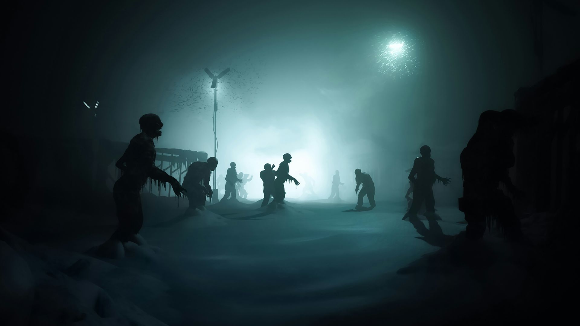 a group of people standing in the snow at night
