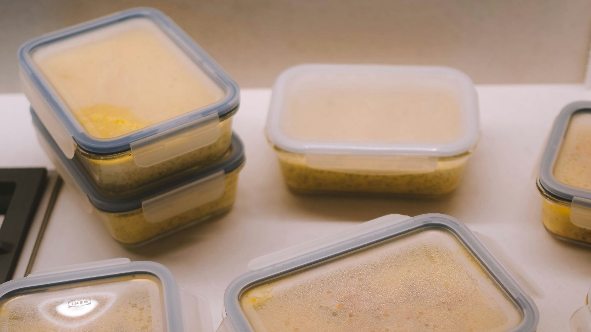 white plastic food container on white table