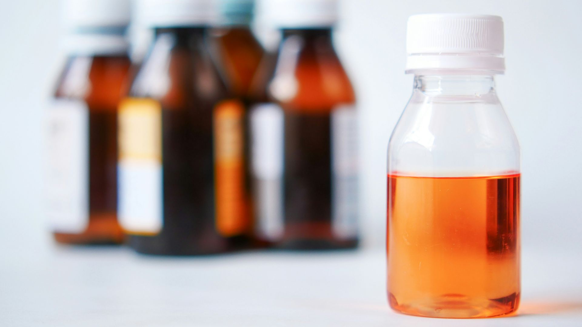 a bottle of liquid sitting on top of a table