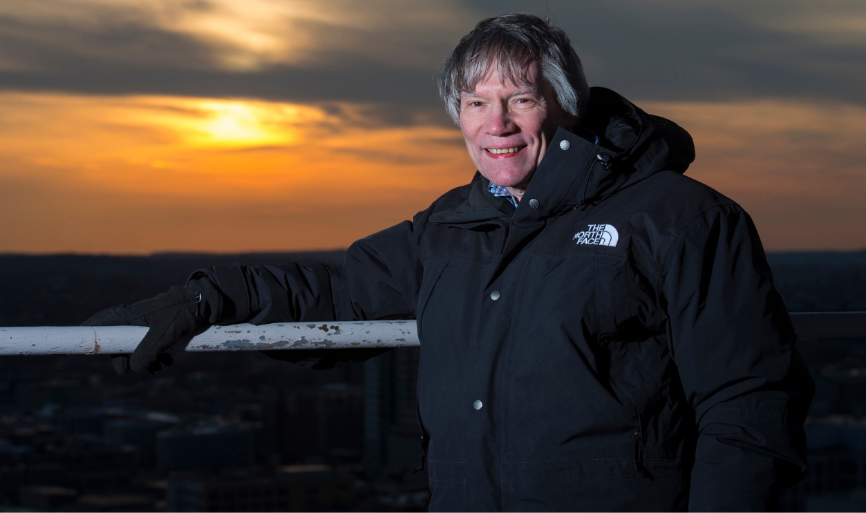 Professor Alan Guth, PhD of the MIT Physics Department with a radio telescope on the roof at MIT on March 14, 2014. Professor Guth was one of the physicists to hypothesize the theory of 