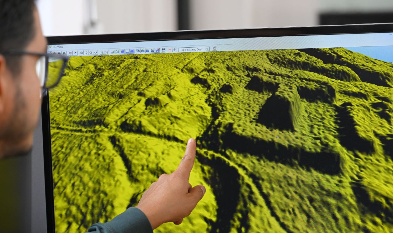 Geomatics analyst at the Institute of Cultural Heritage, Leonardo Auz, shows a digital representation of the relief of an area near the Upano River in the Ecuadorian Amazon, where there would be monumental archaeological remains, at the institute's headquarters in Quito on January 31, 2024. The thickness of the forest protected them for thousands of years, but the passage of machinery and natural erosion have put at risk enormous mounds of an ancient Amazonian civilization in the Upano valley, in Ecuador, where strategies for the conservation of a 