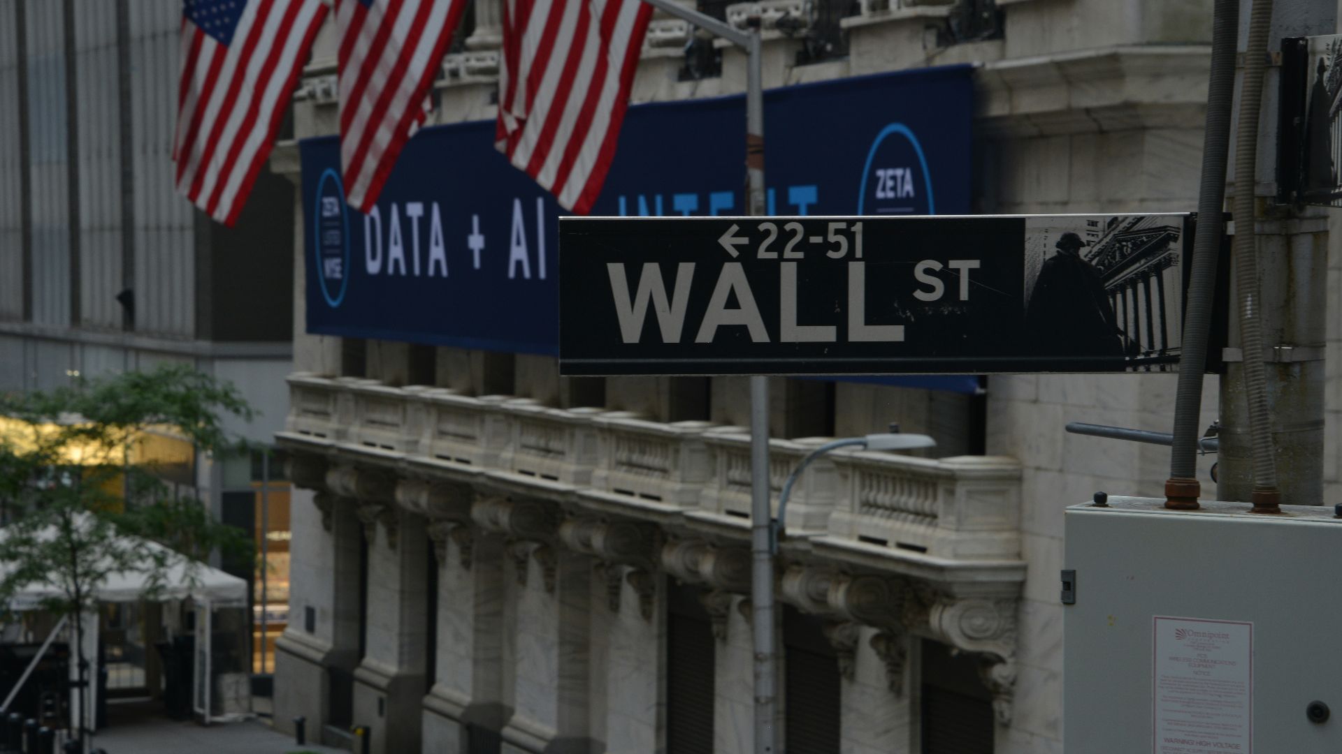 a street sign on wall street in new york city