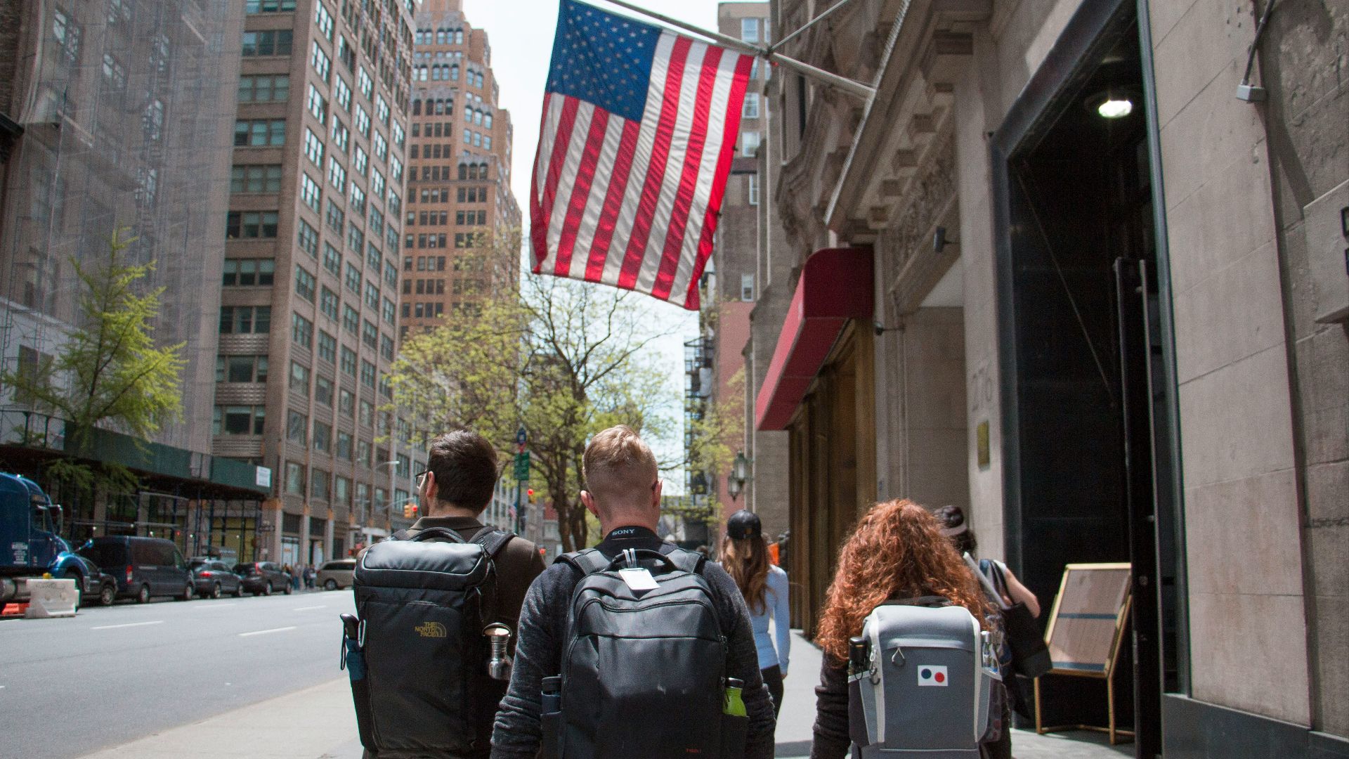 man and woman walking on street during daytime