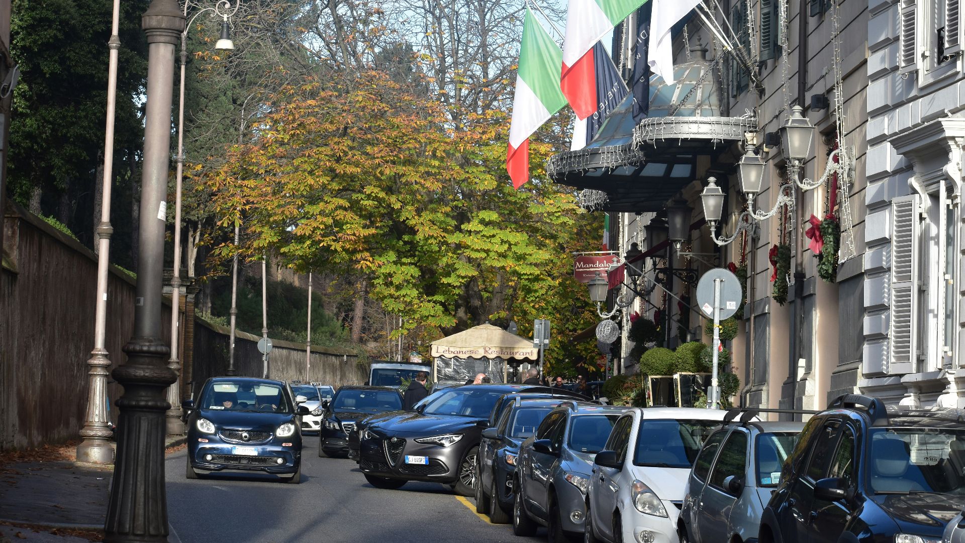 A bunch of cars parked on the side of a street