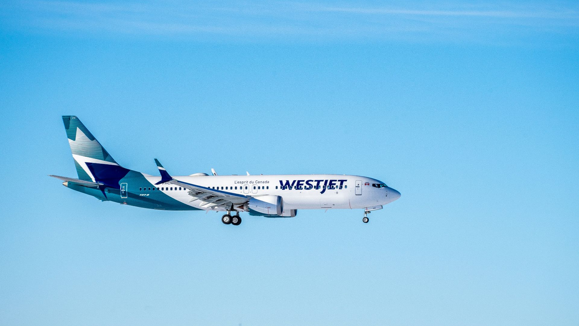 white and red airplane flying during daytime