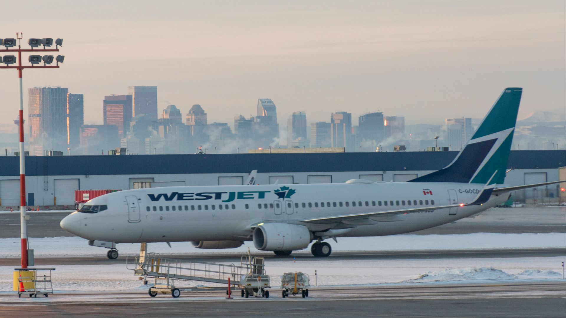 File:WestJet 737-800 in front of Calgary skyline (Quintin Soloviev).png