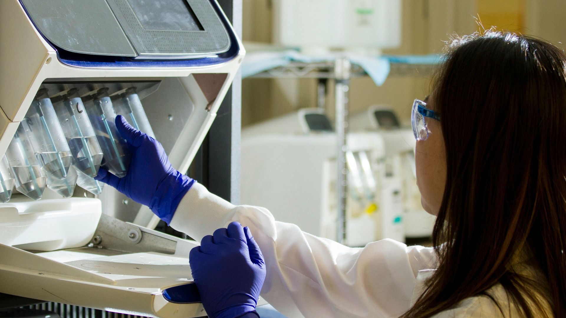 woman holding test tubes