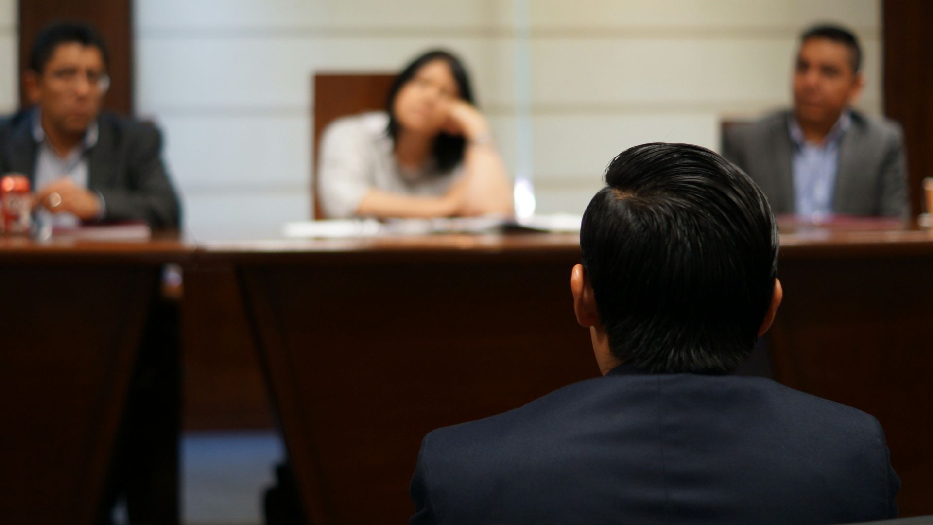 man in black shirt sitting beside woman in white shirt